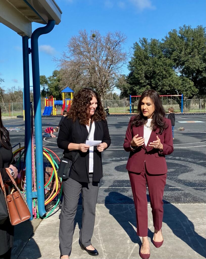 Diana Ramos walks with educator from Bend School