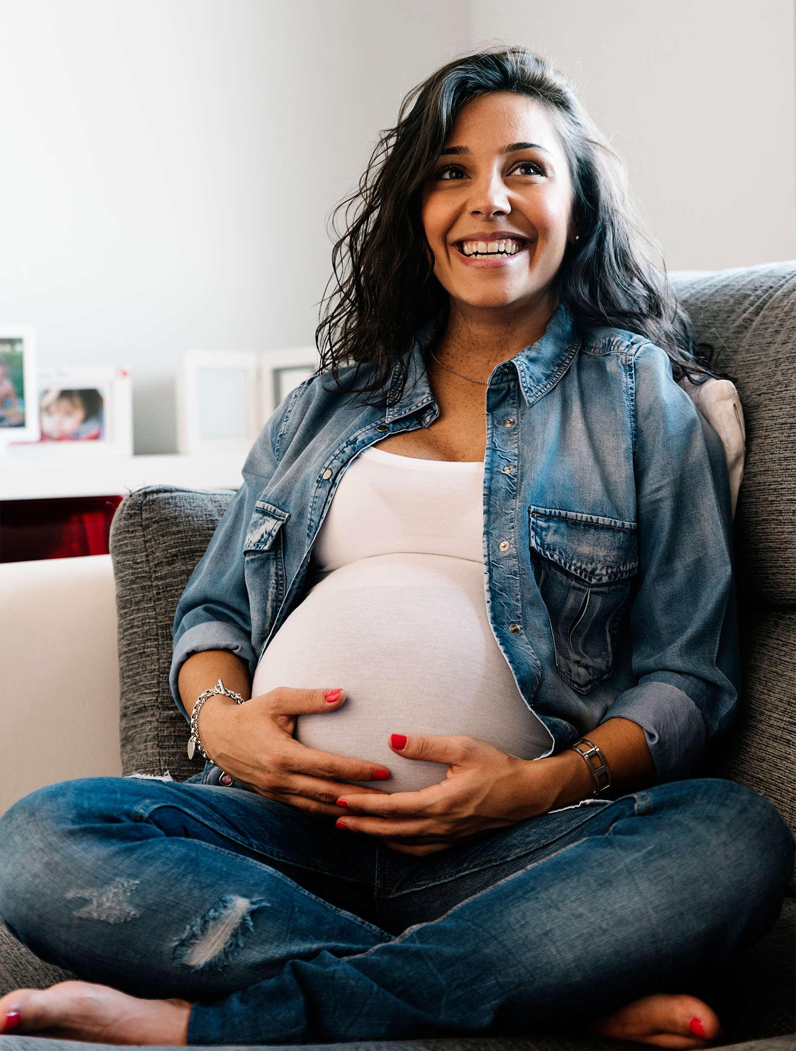 Pregnant woman holding her belly