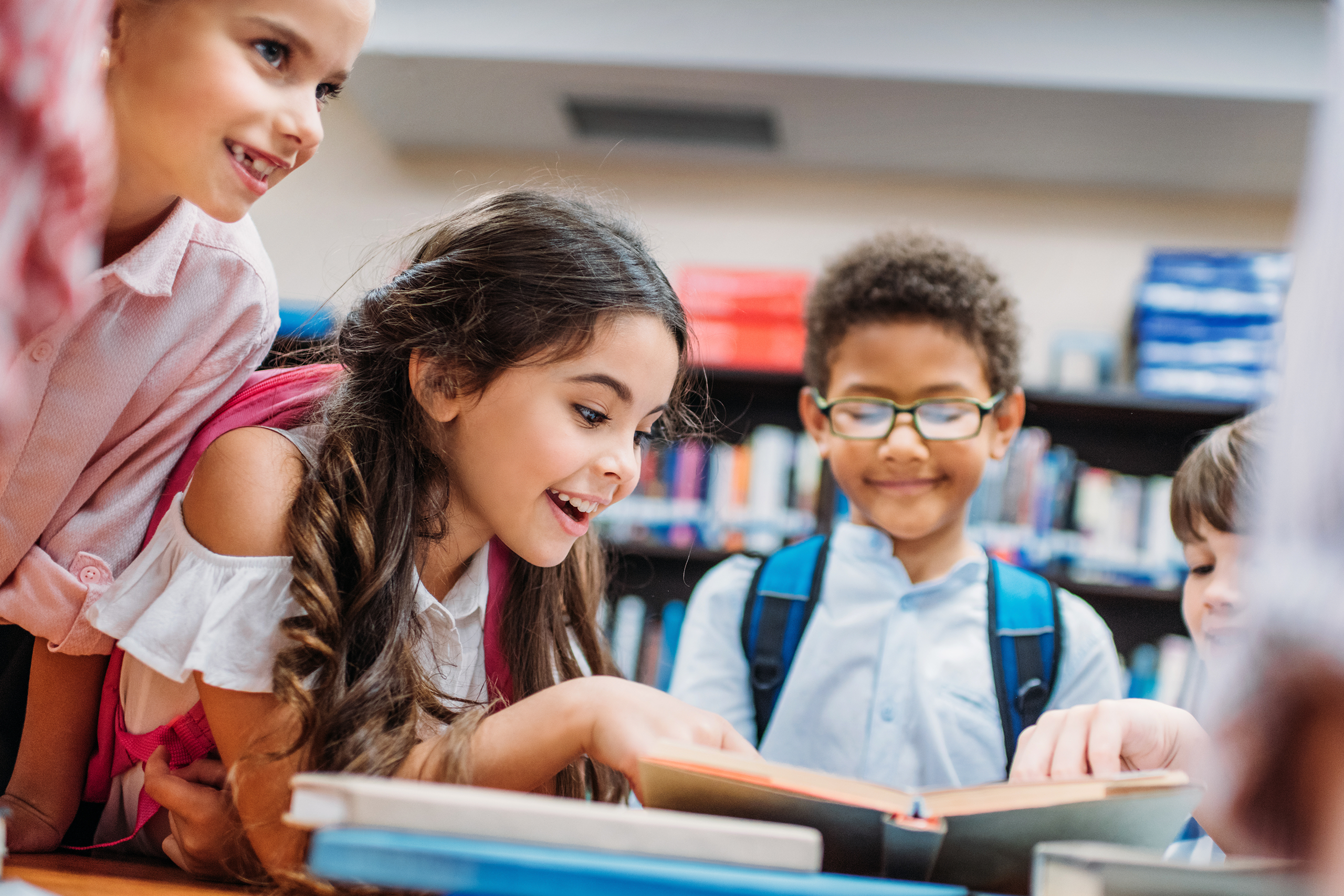 children looking at book
