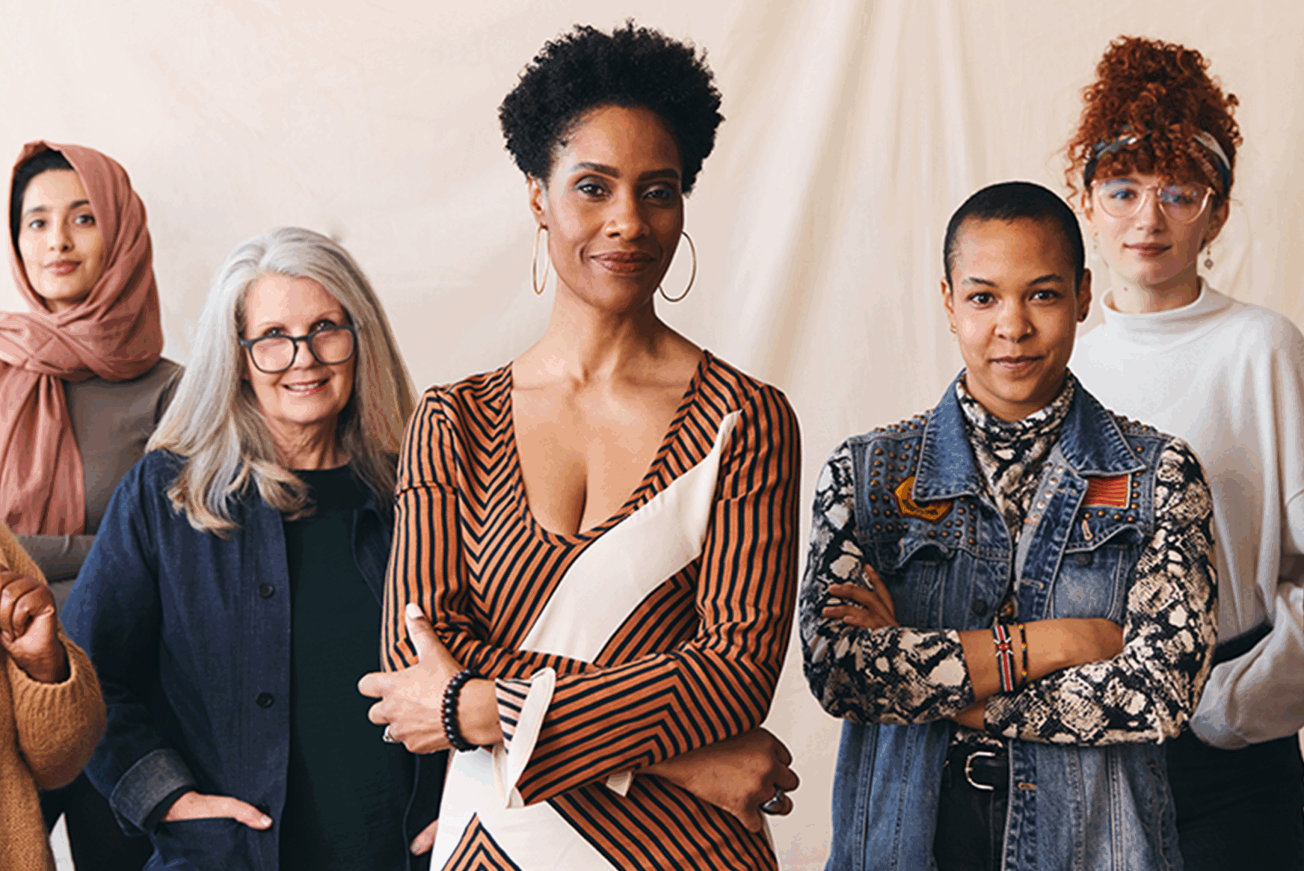 strong group of women standing together looking into camera