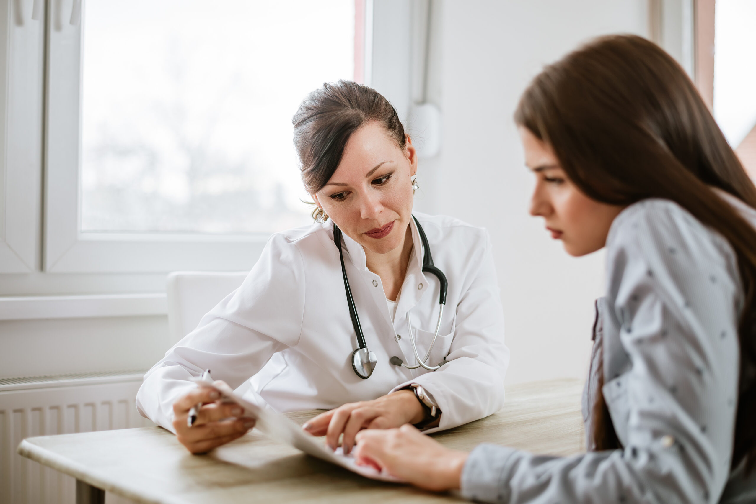 woman consulting with doctor
