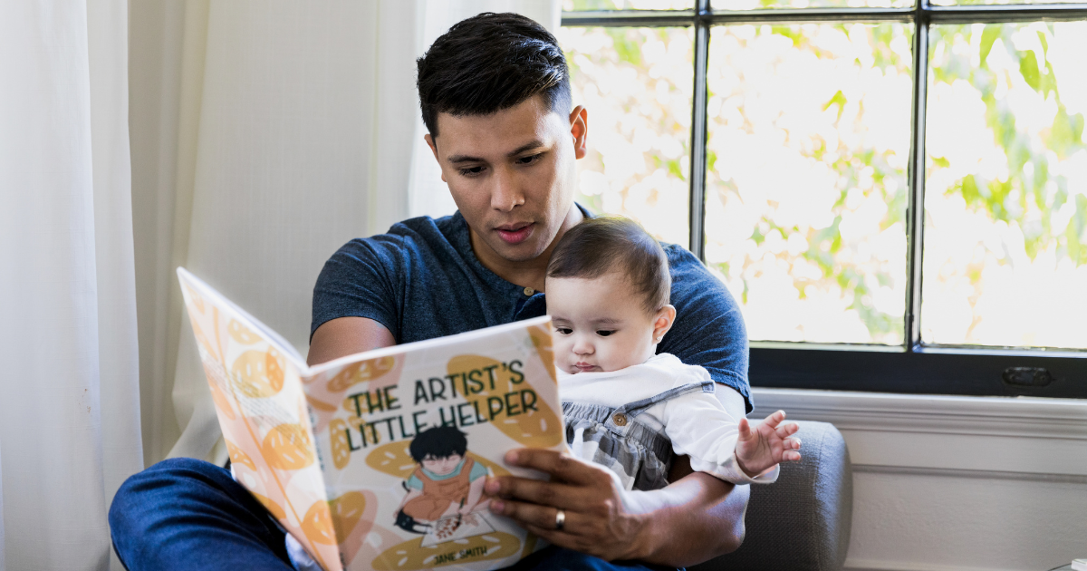 Father reading a book to child
